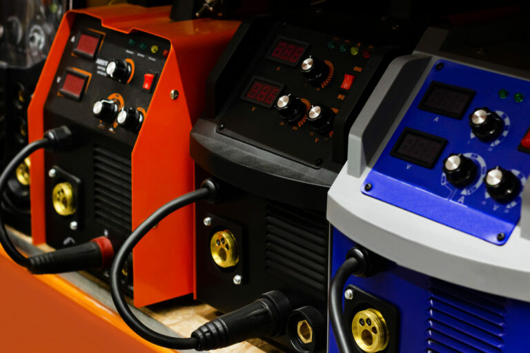 Photo,Of,Various,Type,Welding,Inverters,Standing,On,Construction,Supply
