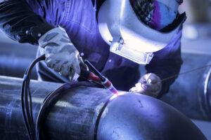 Worker,Welding,Metal,Piping,Using,Tig,Welder/he,Work,In,A
