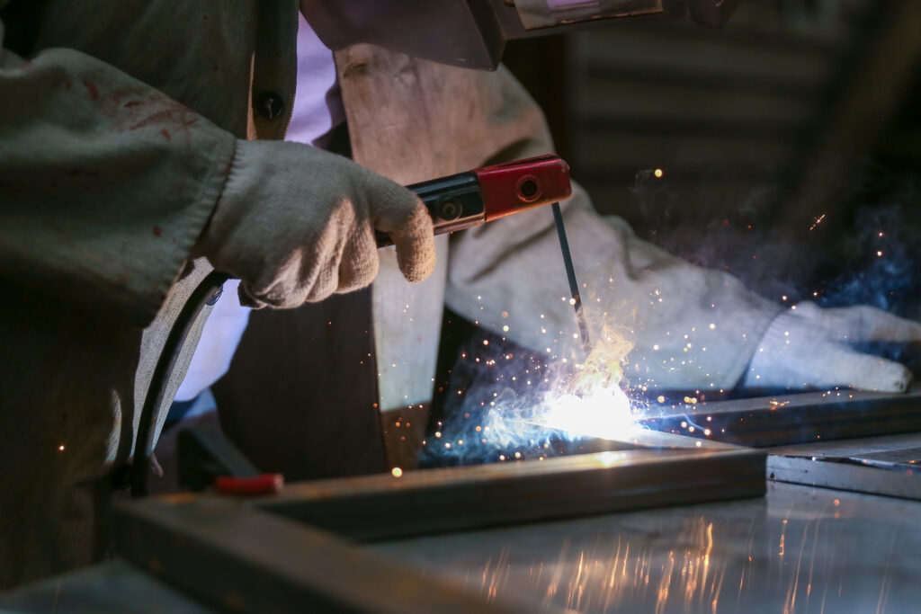 Workman,Welds,Metal,With,Welding,Inverter Workman,Welds,Metal,With,Welding,Inverter
