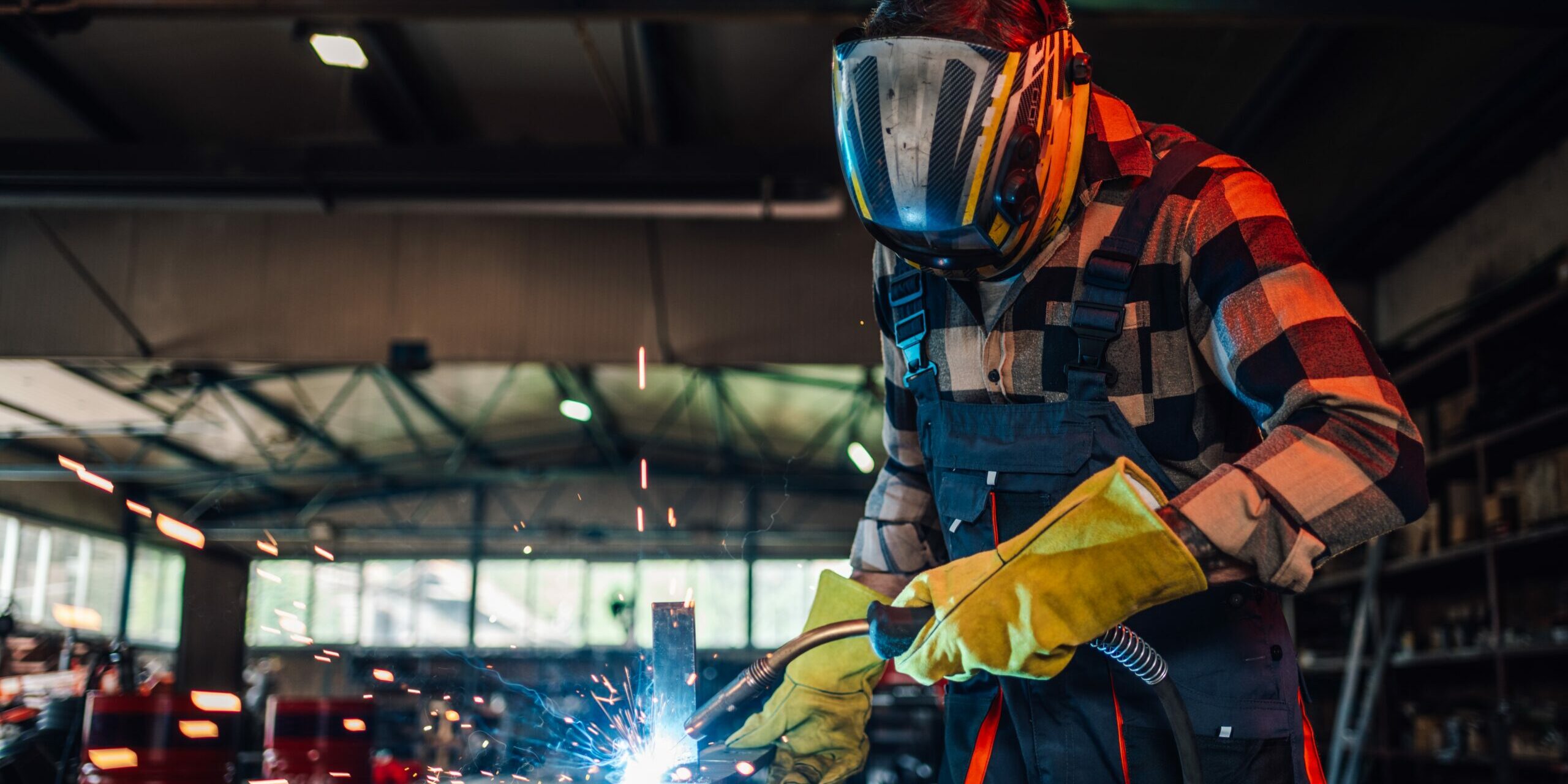 Dedicated,Young,Worker,Welding,A,Piece,Of,Metal,While,Assembling Welding projects for beginners
