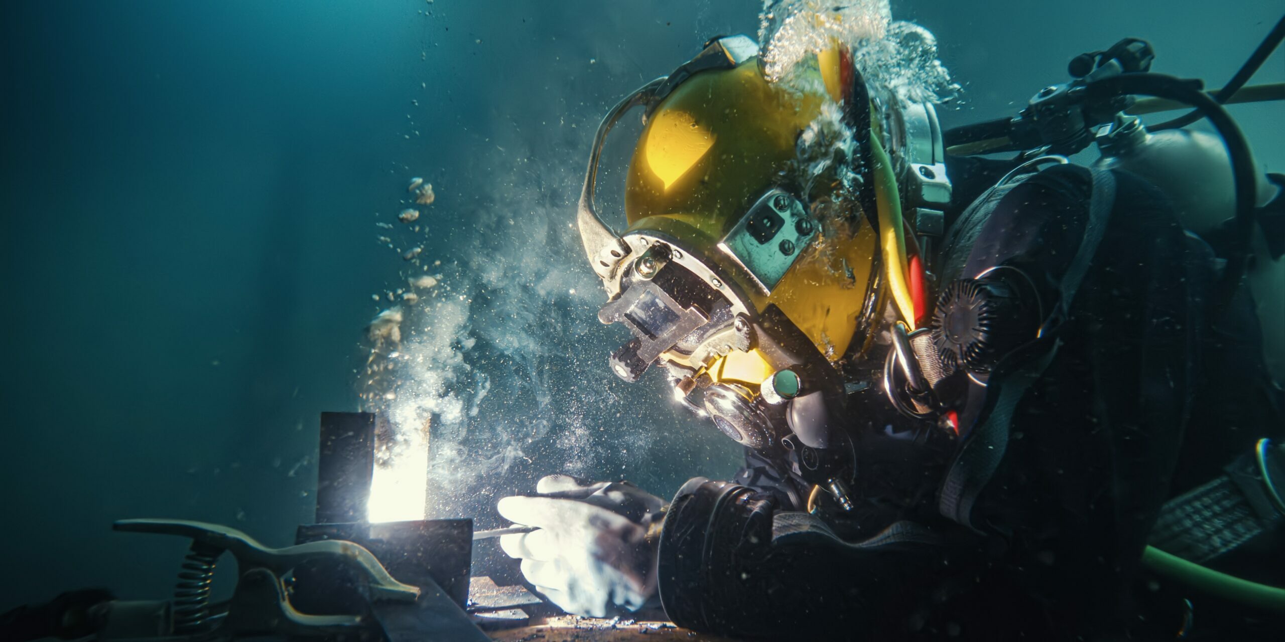 Commercial,Diver,Welding,And,Cutting,Underwater,Closeup The underwater world of welding