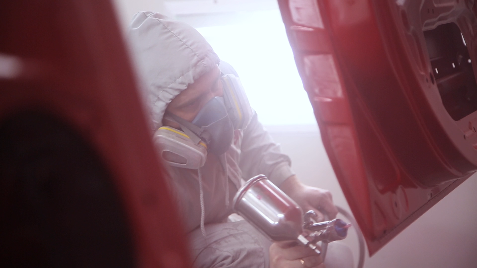 Person spray painting in real environment