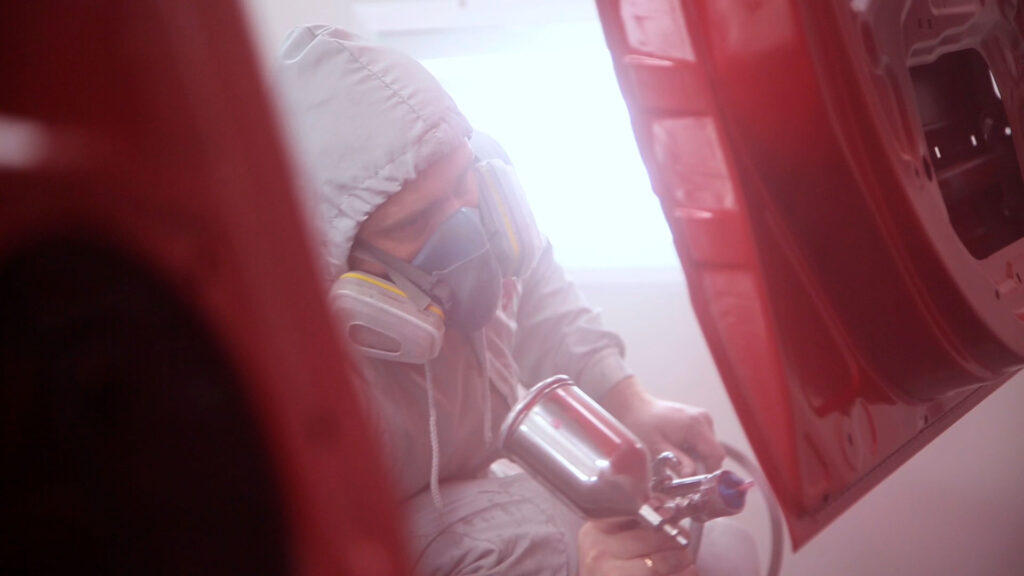 Spray Painting man red car Spray Painting man red car